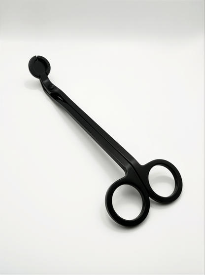 Black metal candle trimmers with curved handle on a white background